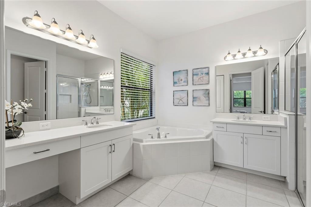 Primary Bathroom with 2 sink, shower, bath tub