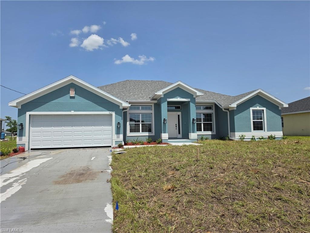Single-story residence featuring a blue stucco exterior with white trim accents