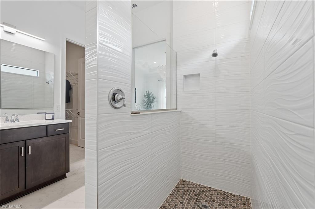 Extended Large Walk-in Shower w/10x28 Wavy Tile