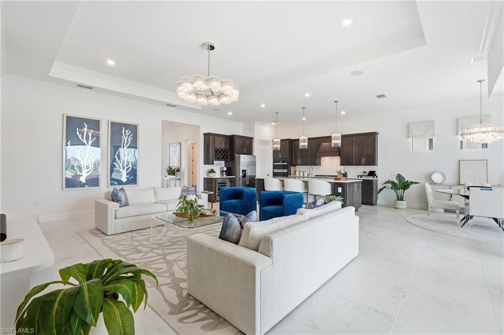 24x24 Porcelain Tile Flooring throughout the Living, Kitchen, Dining, Den and Foyer