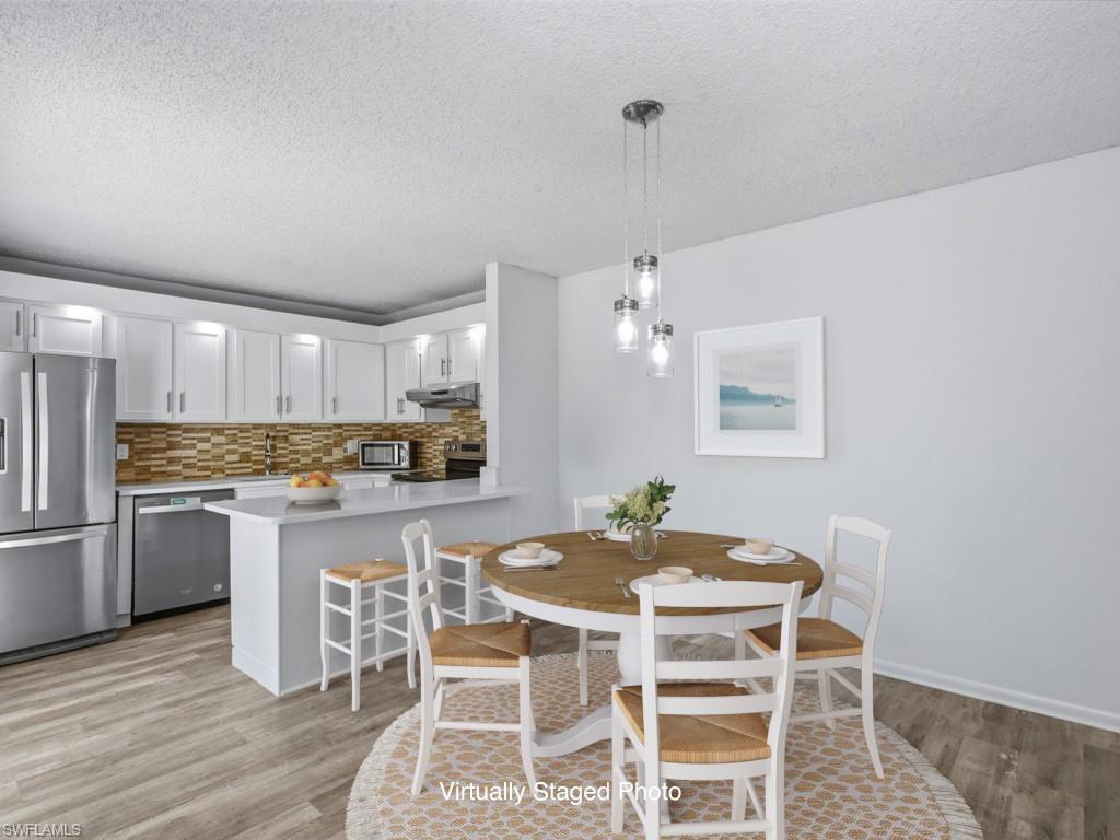 Virtually Staged Dining Room with natural light throughout
