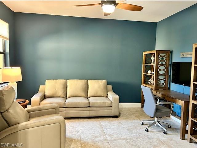 Office featuring tile floors and ceiling fan