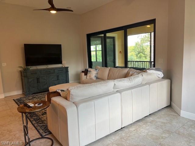 Tiled living room with ceiling fan