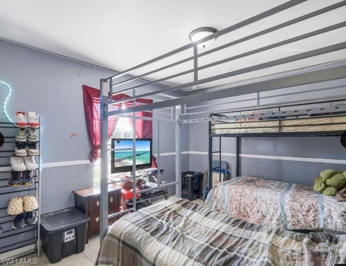 Room featuring a high-ceiling and light fixture