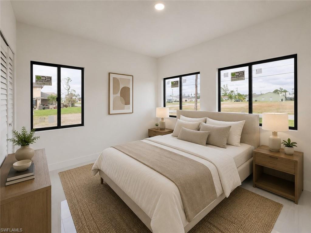 Bright room with white walls, recessed ceiling lighting, and multiple black-framed windows
