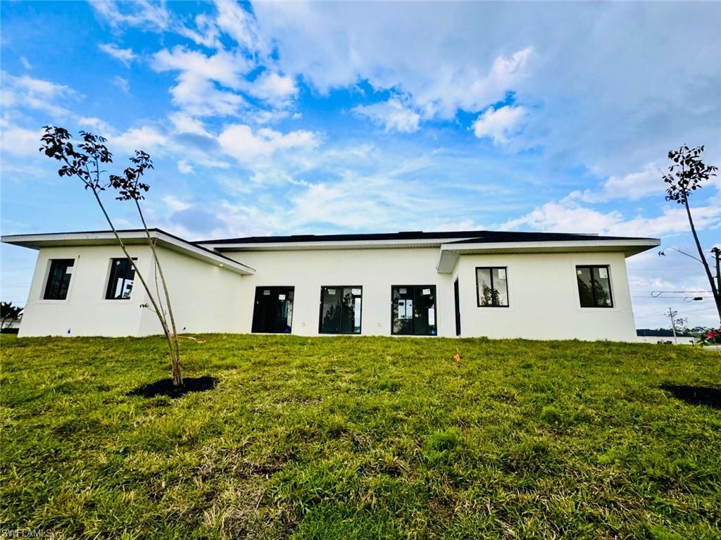 Contemporary single-story exterior with a white stucco finish