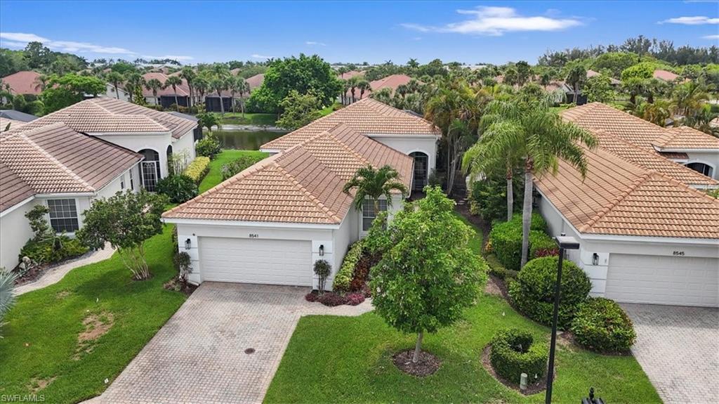 Aerial perspective of suburban area with a nearby body of water