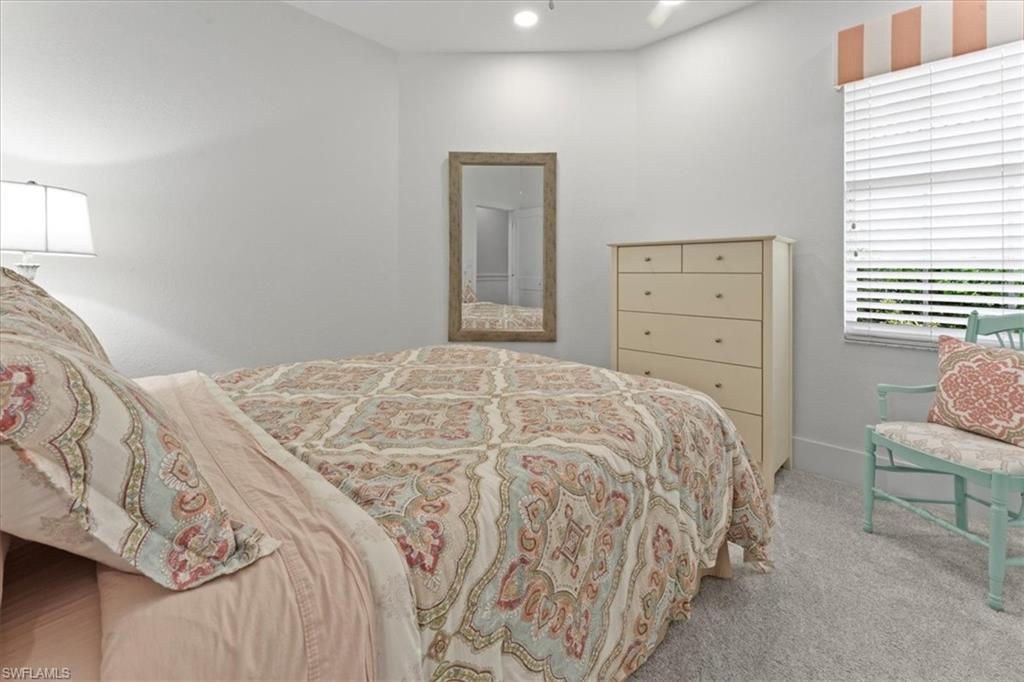 Carpeted bedroom featuring recessed lighting