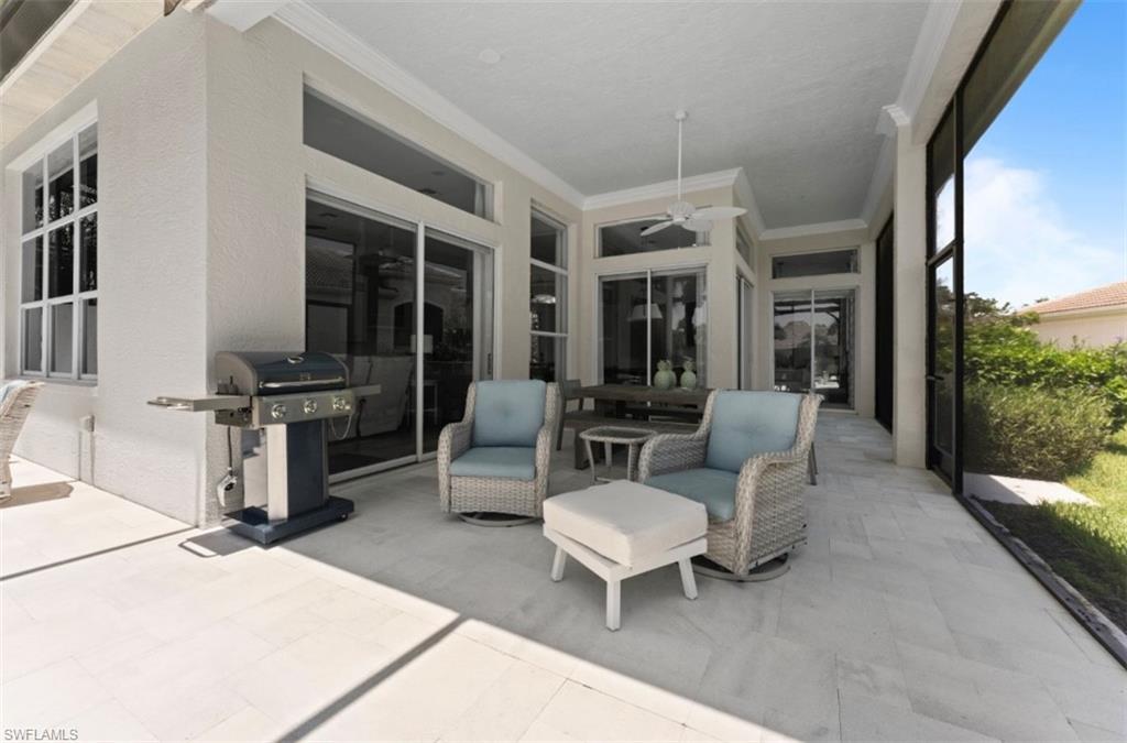 View of patio / terrace featuring a grill and a ceiling fan
