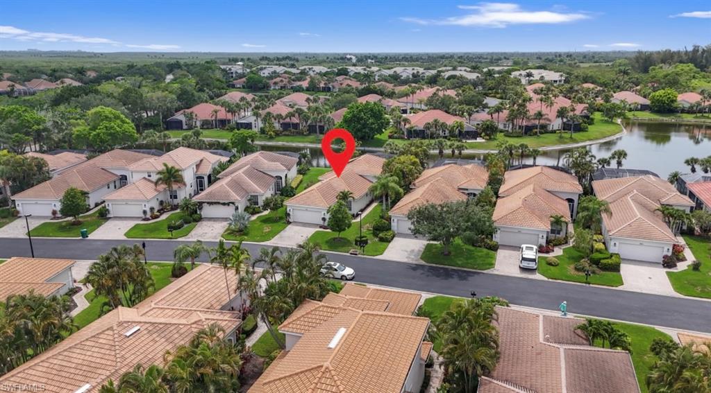 Aerial perspective of suburban area with a nearby body of water