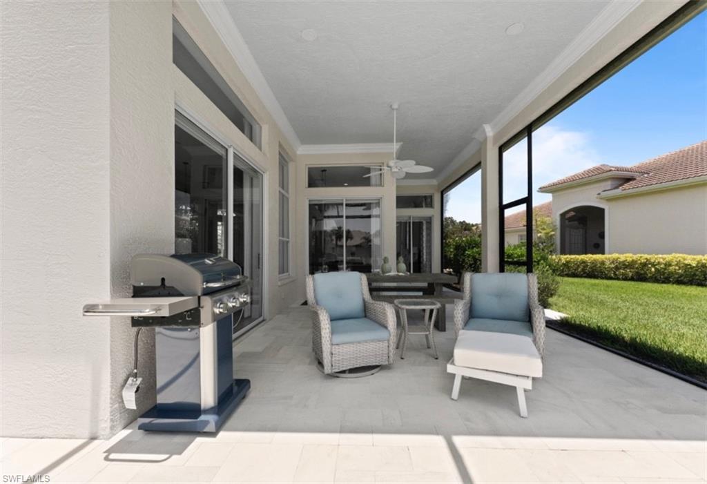 Sunroom / solarium with a ceiling fan