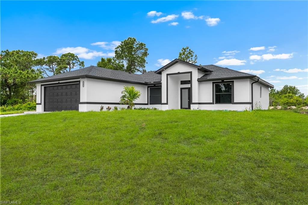 Contemporary exterior featuring white stucco and dark trim accents