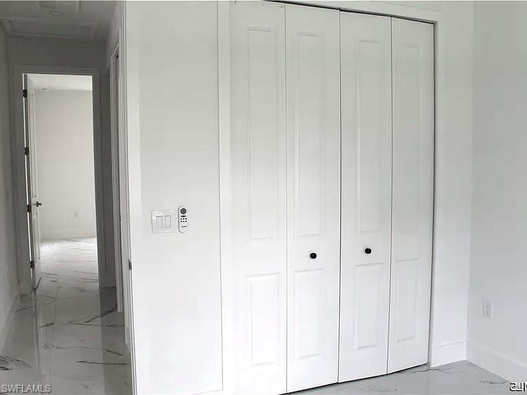 White bi-fold doors with black hardware