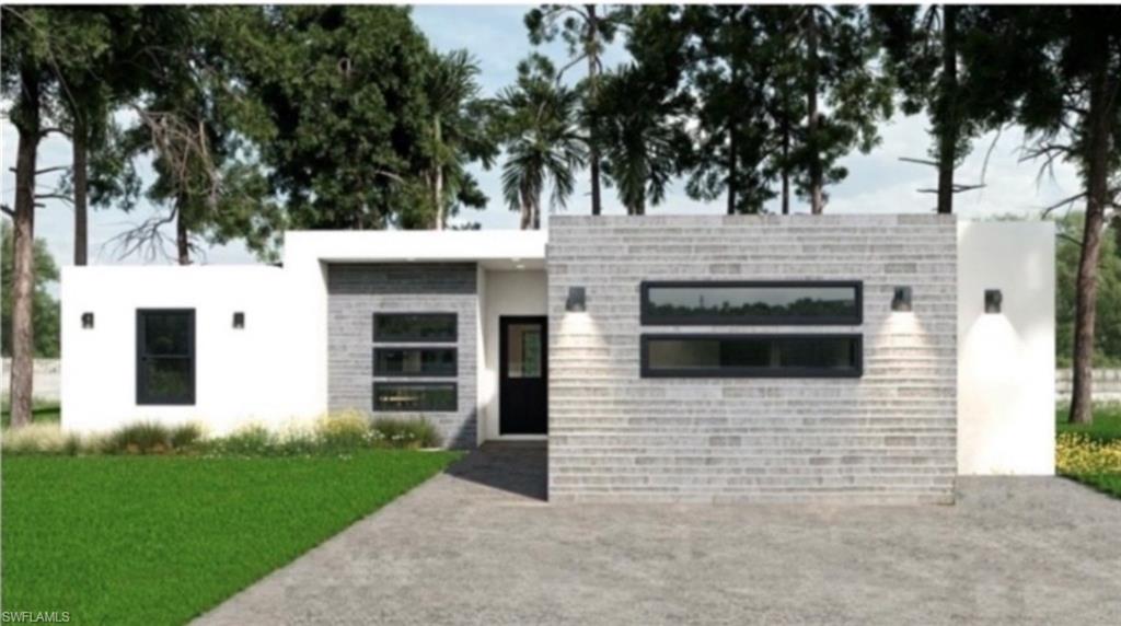Contemporary exterior featuring a flat roofline, white stucco siding, grey brick accents, black-framed windows, and a dark entry door