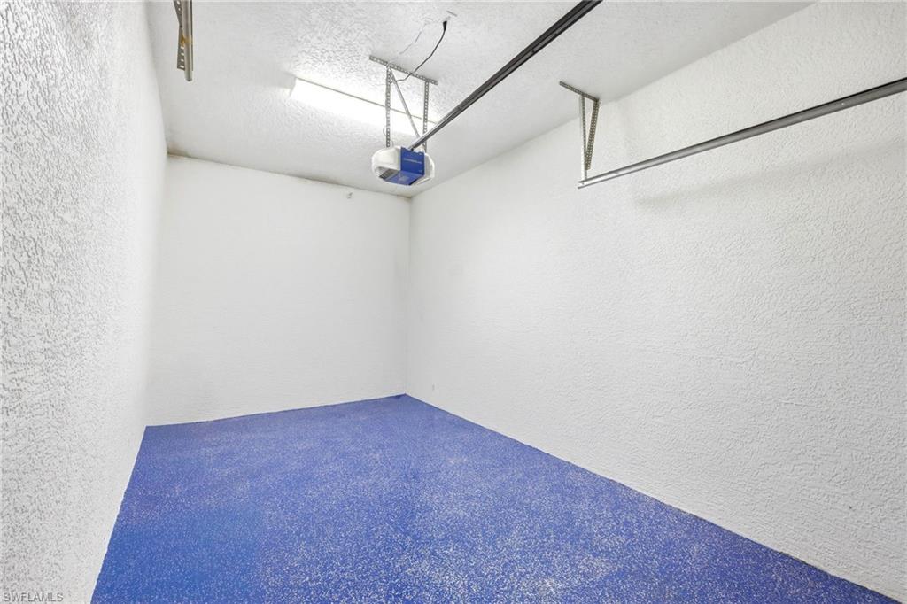 One car garage sporting an epoxy floor