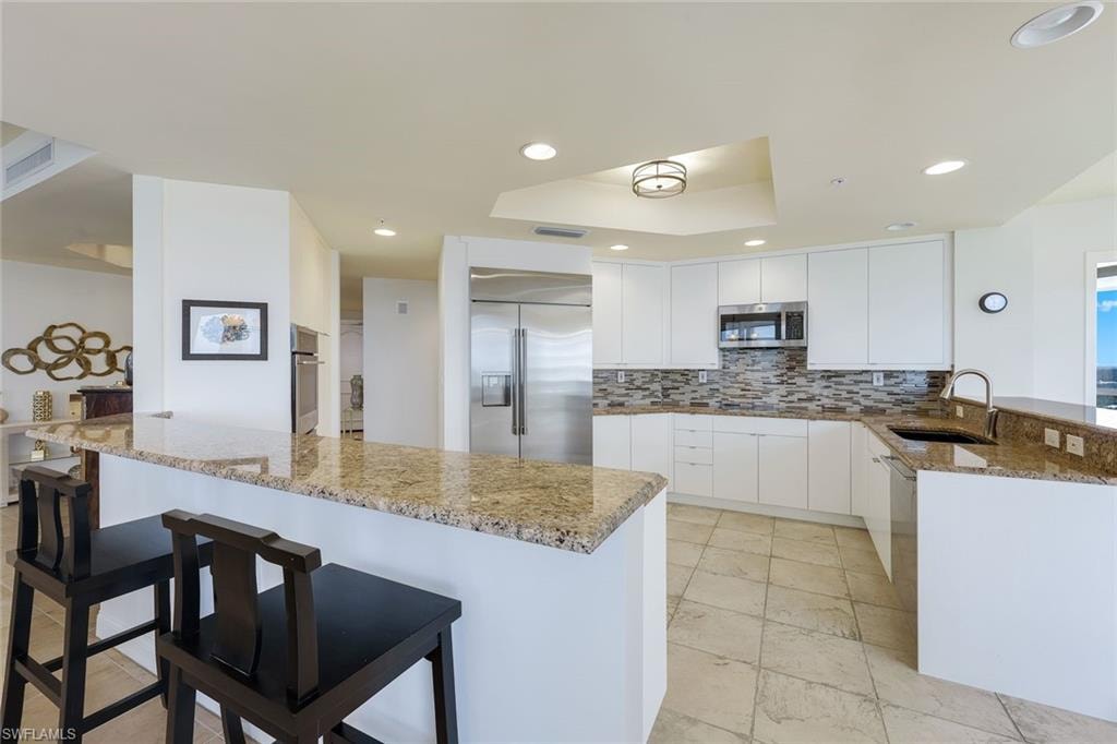 Kitchen features stainless appliances, ample storage and plenty of room for two chefs.