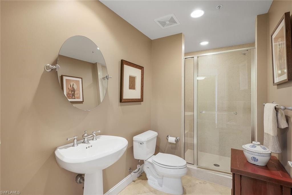Guest bathroom features a walk-in shower.