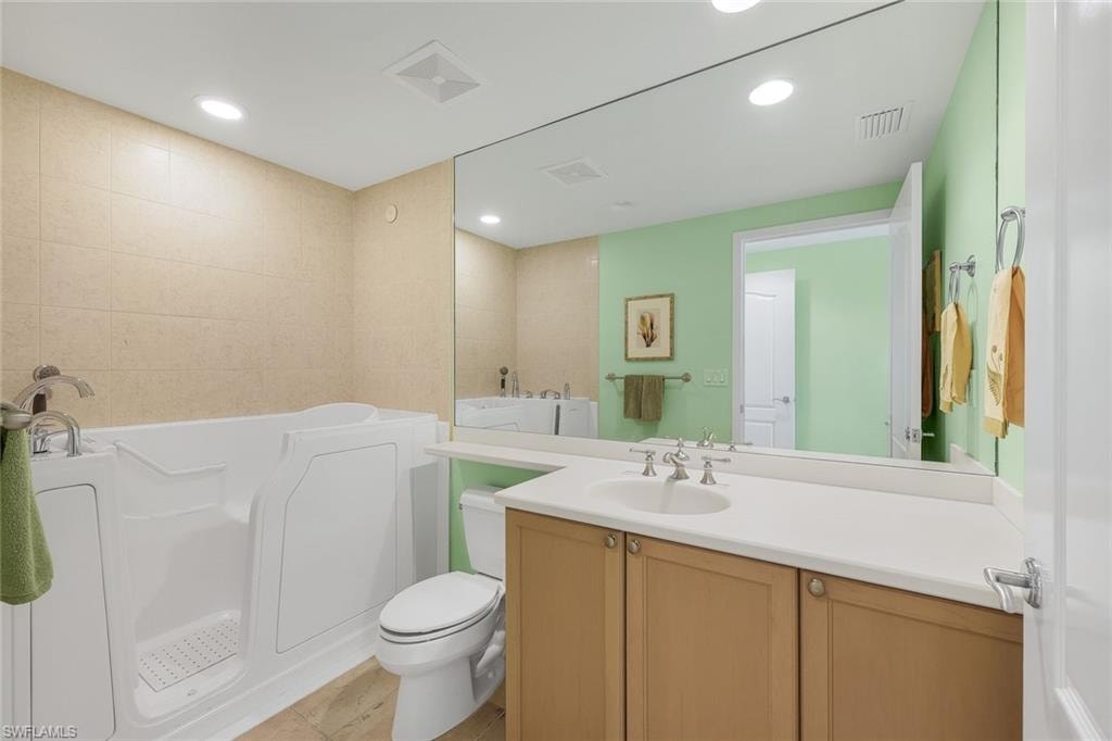 Ensuite guest bathroom features a walk-in tub.