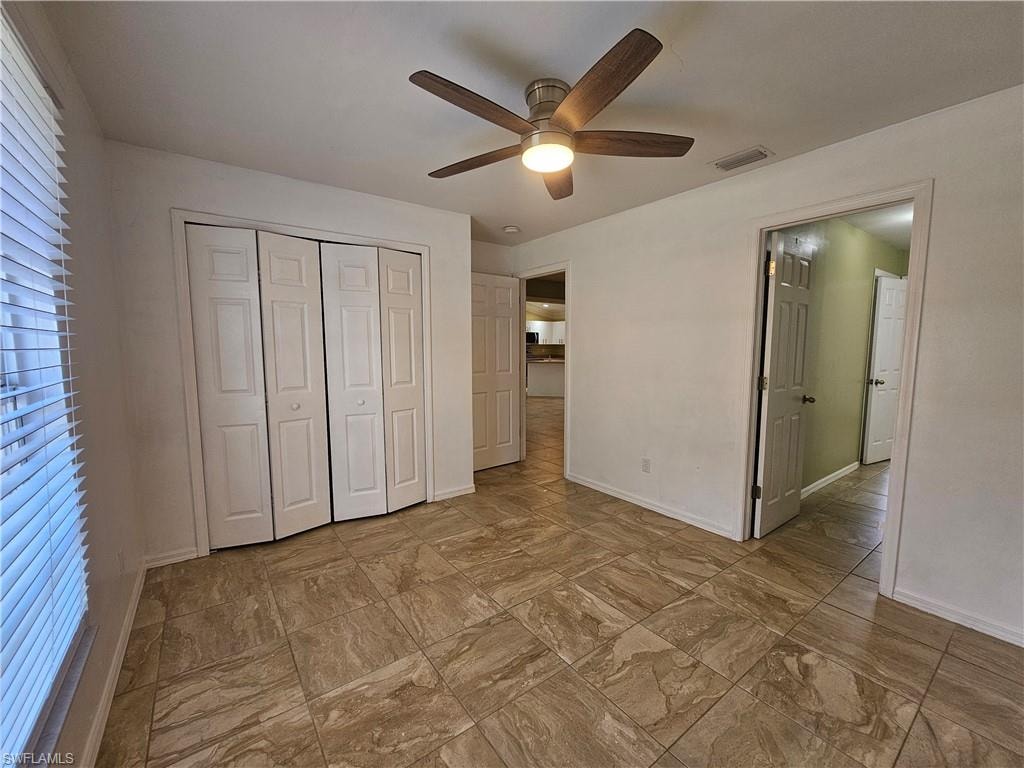 Neutral-toned tile flooring throughout the space