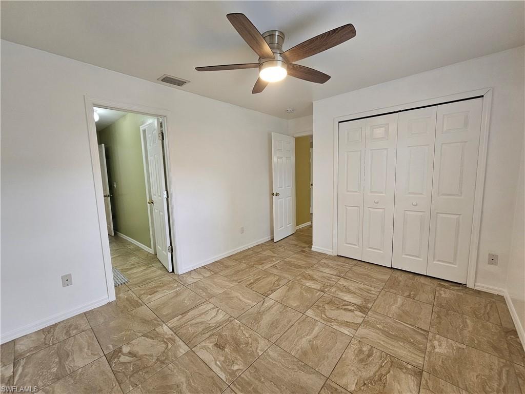 White walls with light-toned tiled flooring