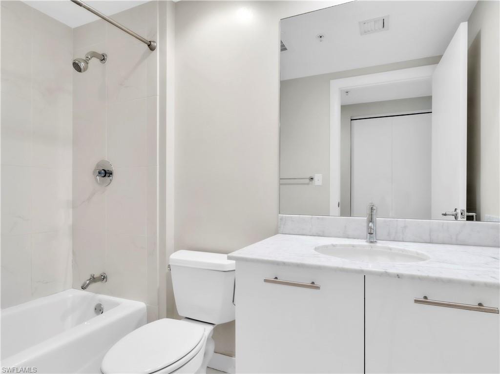 Bathroom with vanity and  shower combination