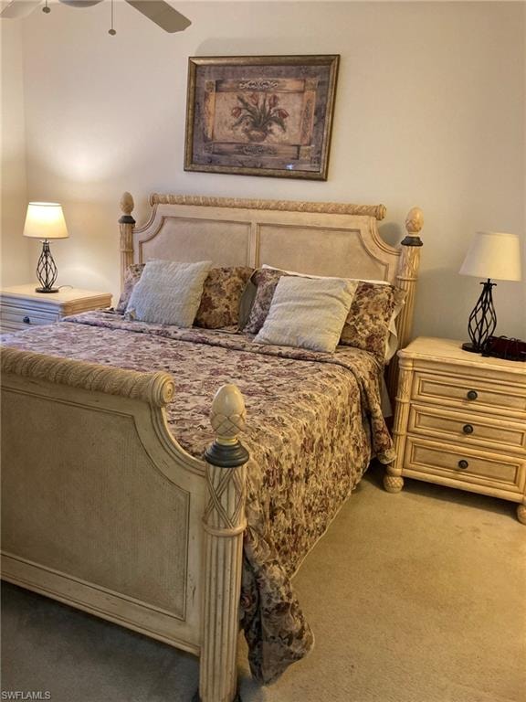 Carpeted bedroom with ceiling fan