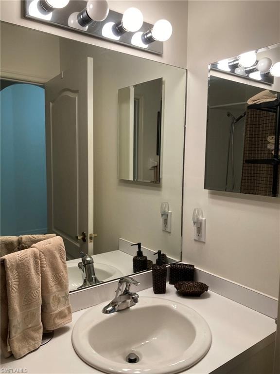 Bathroom featuring vanity and a shower with shower curtain