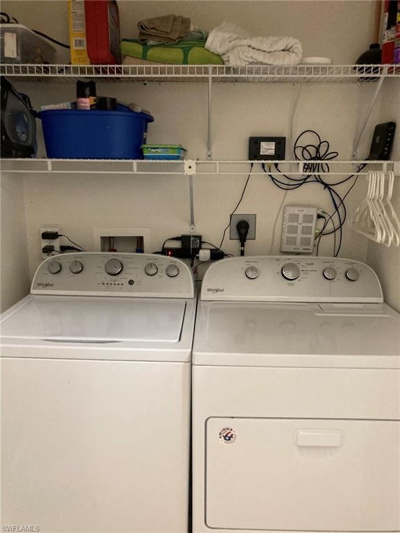 Washroom with washing machine and clothes dryer