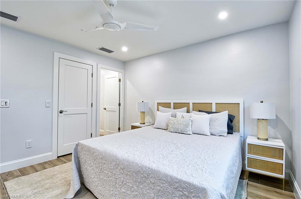 Bedroom featuring ceiling fan and hardwood / wood-style flooring