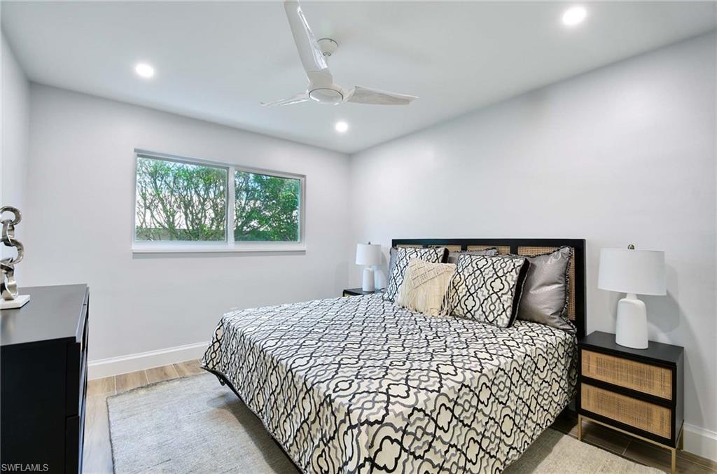 Bedroom featuring ceiling fan and hardwood / wood-style floors