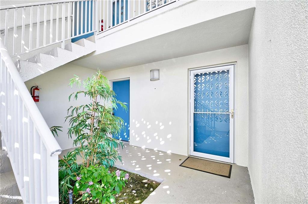 Doorway to property with a balcony