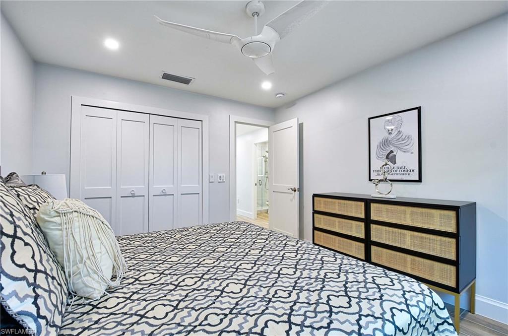 Bedroom with a closet, ceiling fan, and carpet floors