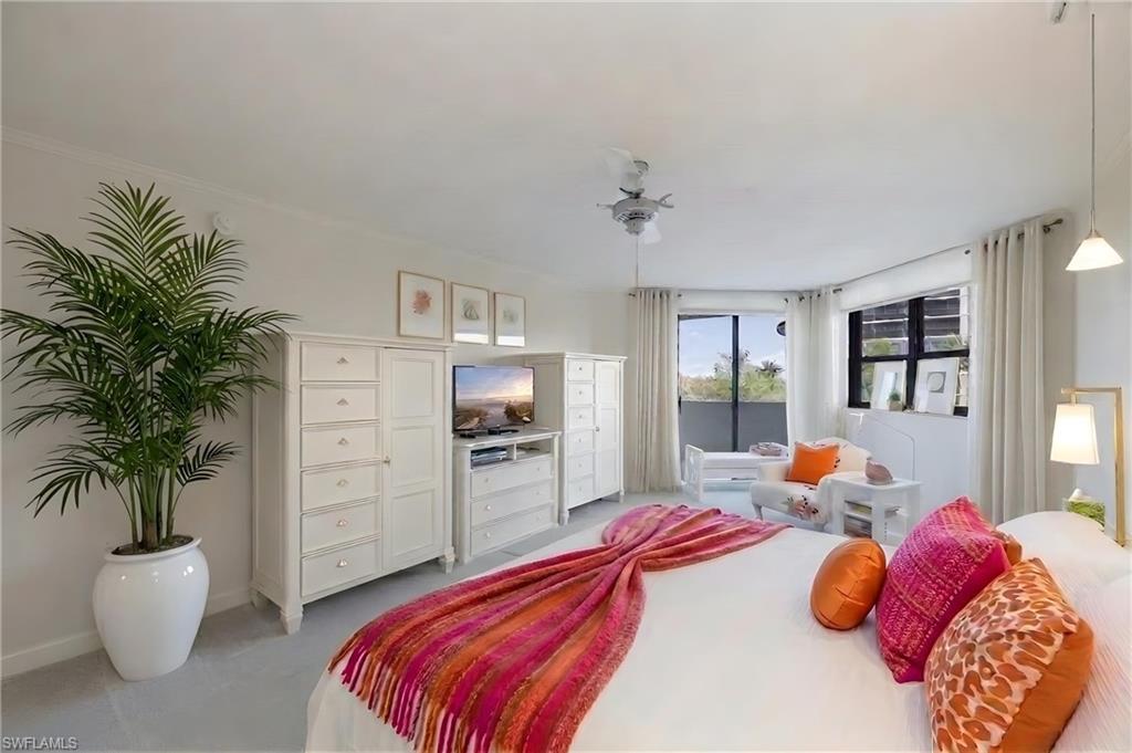 Bedroom featuring light gray carpeting and white walls