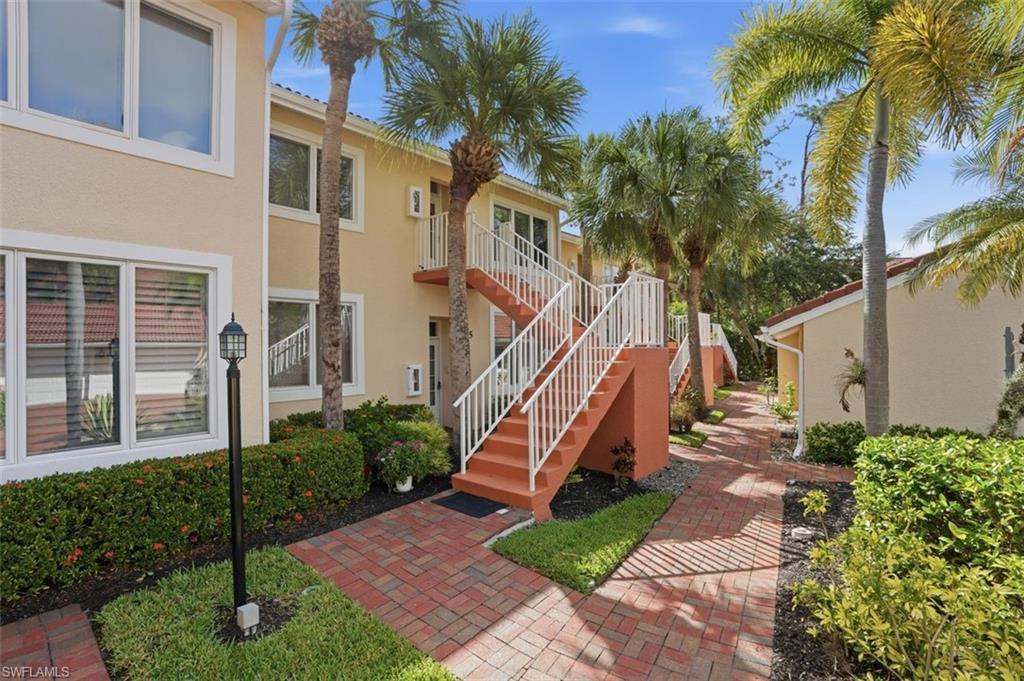 Lovely brick walkways and picturesque palm trees welcome you to your condo in paradise