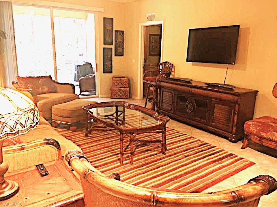 9' Ceilings add Volume. Tile on diagonal. Door to Master Suite. Sliders to Lanai.