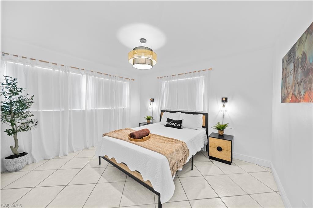 Bright interior space featuring light-colored tile flooring