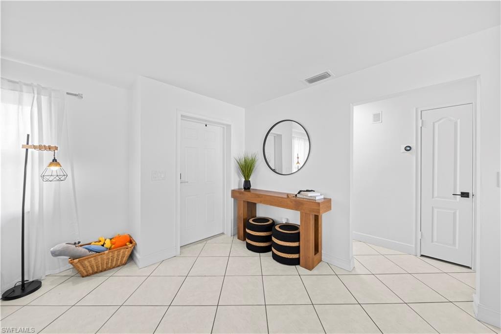 Tiled flooring extending throughout the space