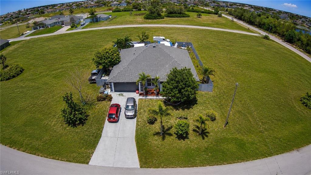 Single-story residence with a gray shingle roof and an attached two-car garage