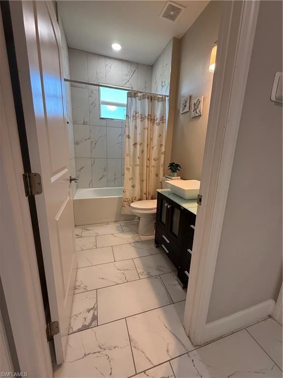 Contemporary bathroom featuring large format tile flooring, a white bathtub with a tiled surround, a dark wood-finish vanity with an integrated vessel sink, and an overhead recessed light
