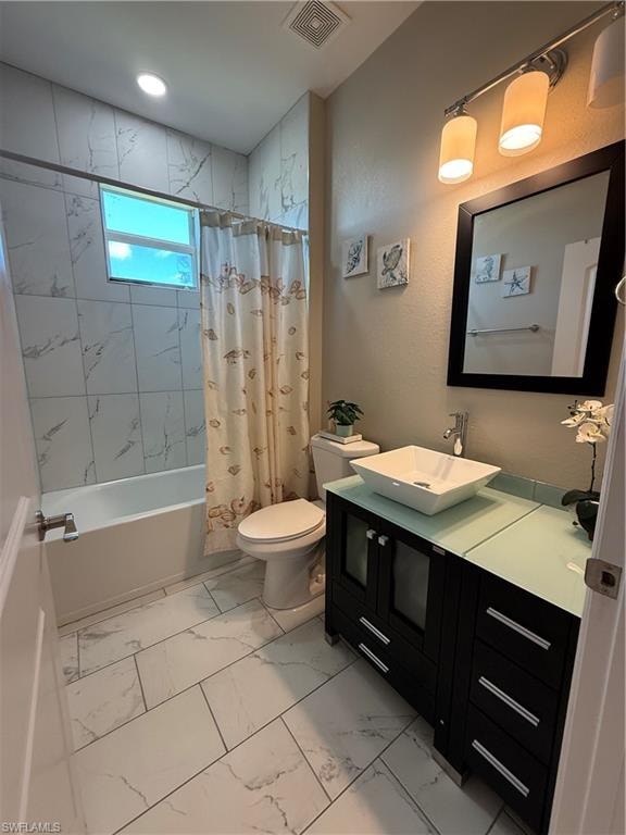 Bathroom featuring a dark wood-finish vanity with a vessel sink, a frosted glass countertop, and a framed mirror