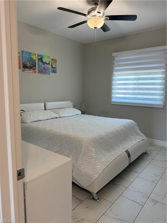 Room featuring light-toned walls and tile flooring