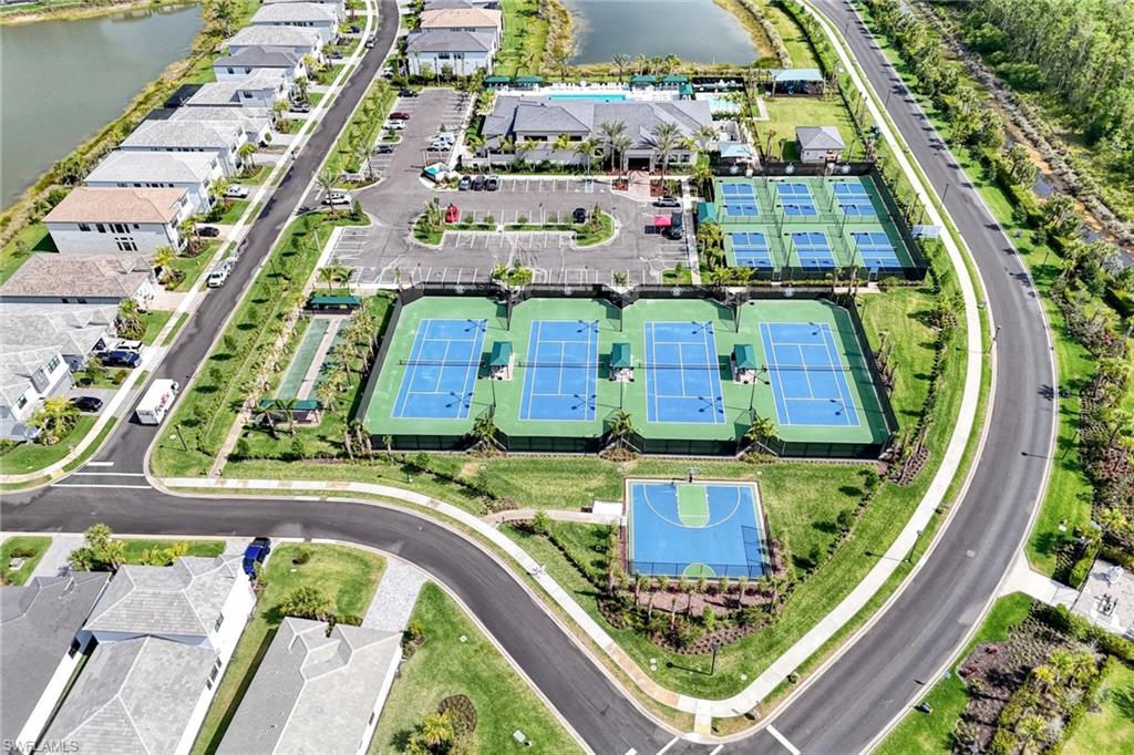Drone / aerial view with a water view and a residential view