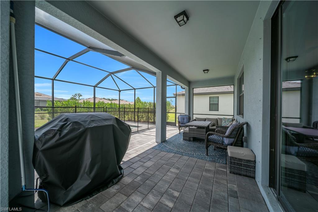Large covered lanai with screened pool and spa