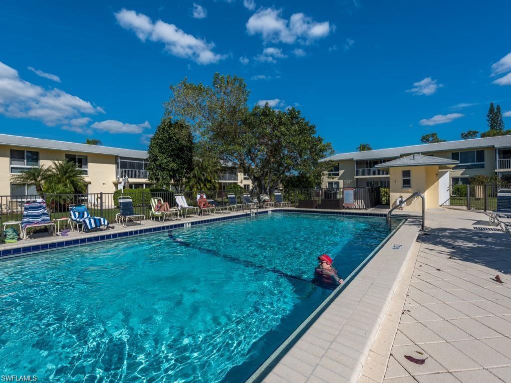 Community pool behind condo