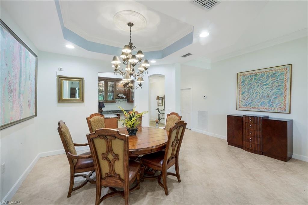 Dining Room with open dry bar area with refrigerator