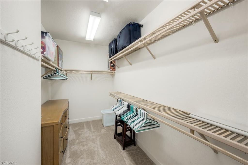 We dream about closet spade like this.  Primary bedroom closet