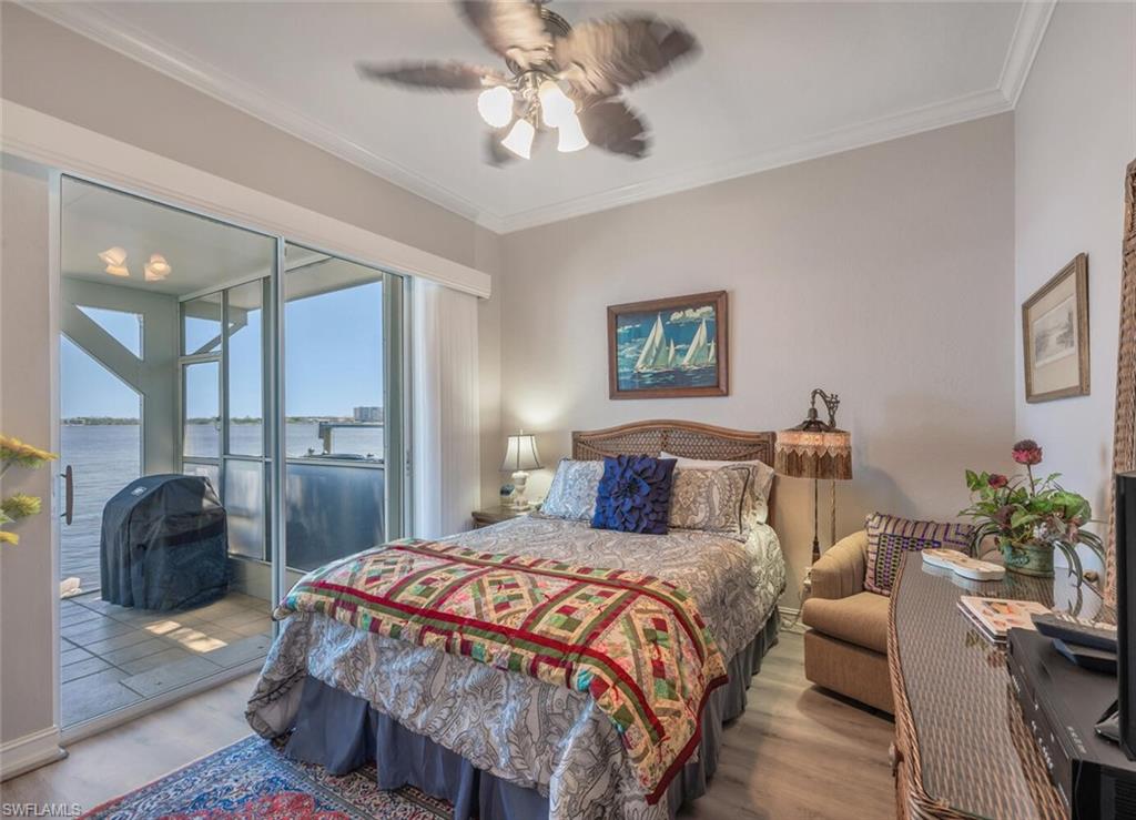 GUEST BEDROOM 1 W/SLIDERS TO LANAI & LUXURY VINYL FLOORING