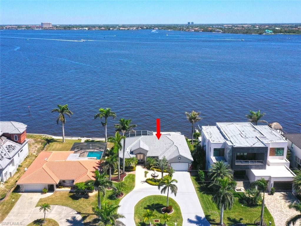 AERIAL OF HOME ON RIVER