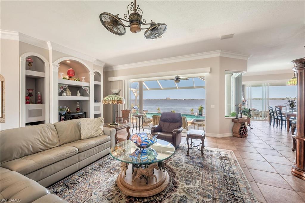 Virtually modified photo-GREAT ROOM FACING LANAI & RIVER