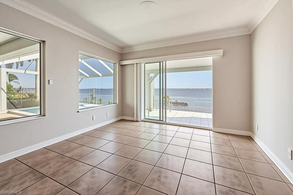DINING ROOM W/SLIDERS TO LANAI & RIVER VIEW